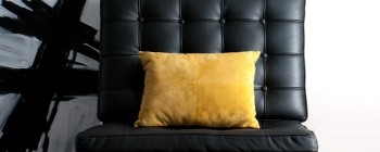 Black Chair with yellow pillow