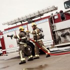 firemen simulating fighting fire