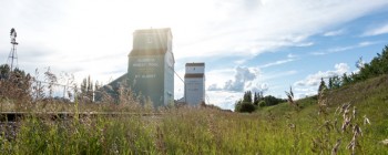 landscape with grain elevators in the background