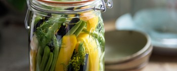 jar with dill, pickles, cucumber and beans