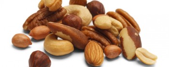 Variety of Mixed Nuts Isolated on White Background.